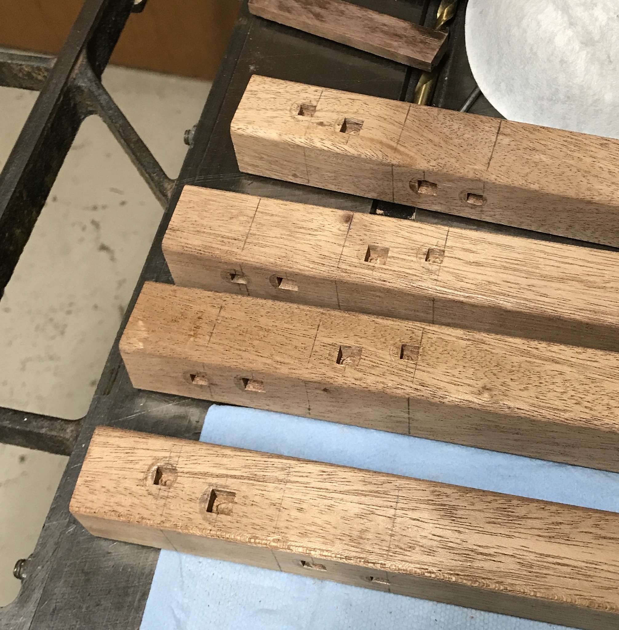 All square holes formed in the table legs